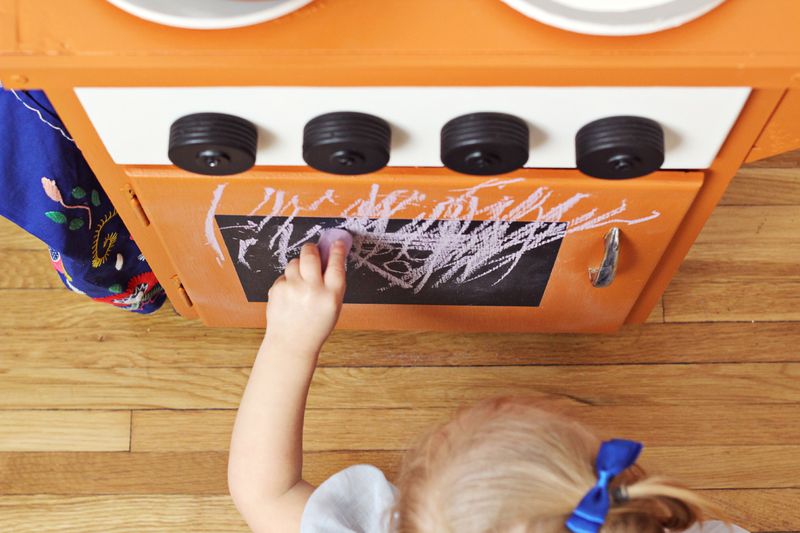 Chalkboard door on adorable kid's kitchenette