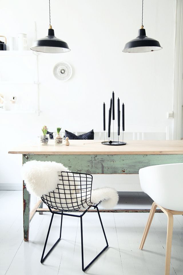 Simple Scandinavian dining room with lots of white and touches of green and black
