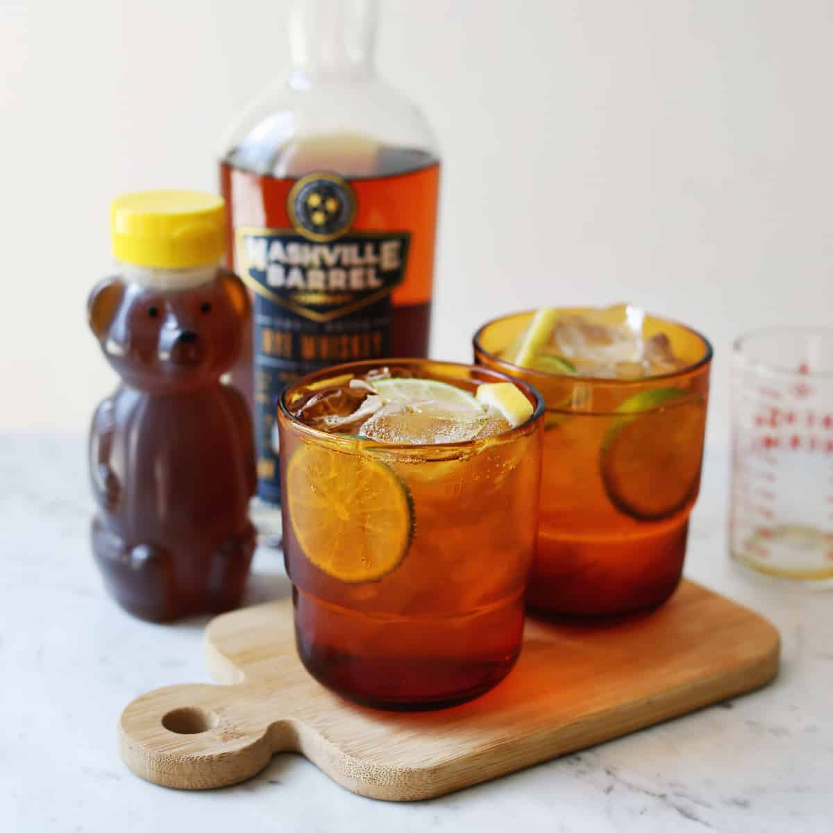 whiskey ginger cocktails on wooden board