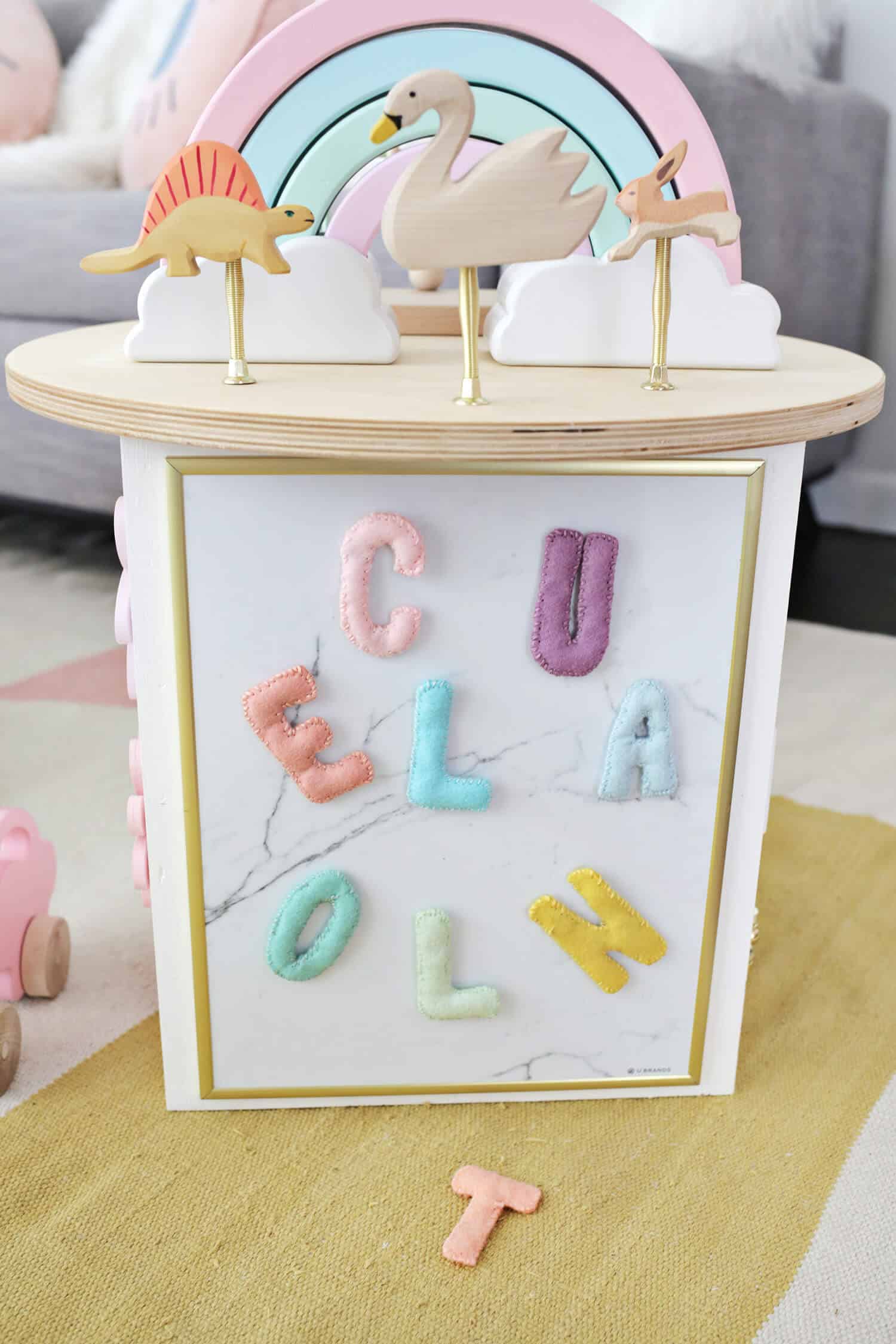 close up of felt letters on magnetic board on toddler activity center