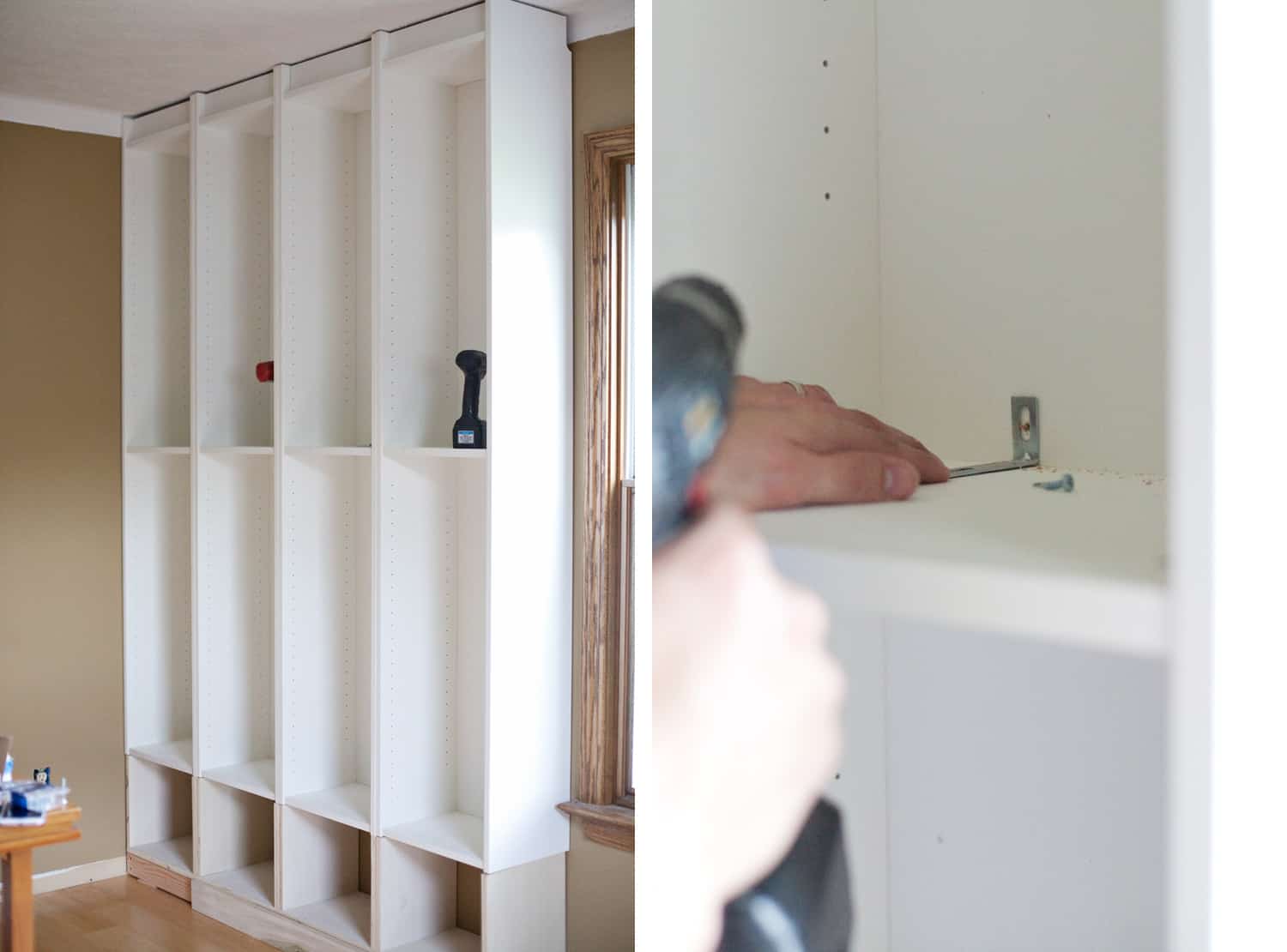 white empty bookcase against wall with someone drilling brackets into wood