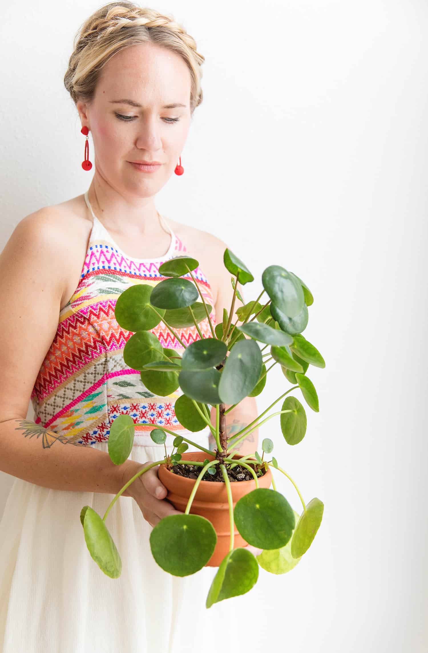 Emma holding a potted plant