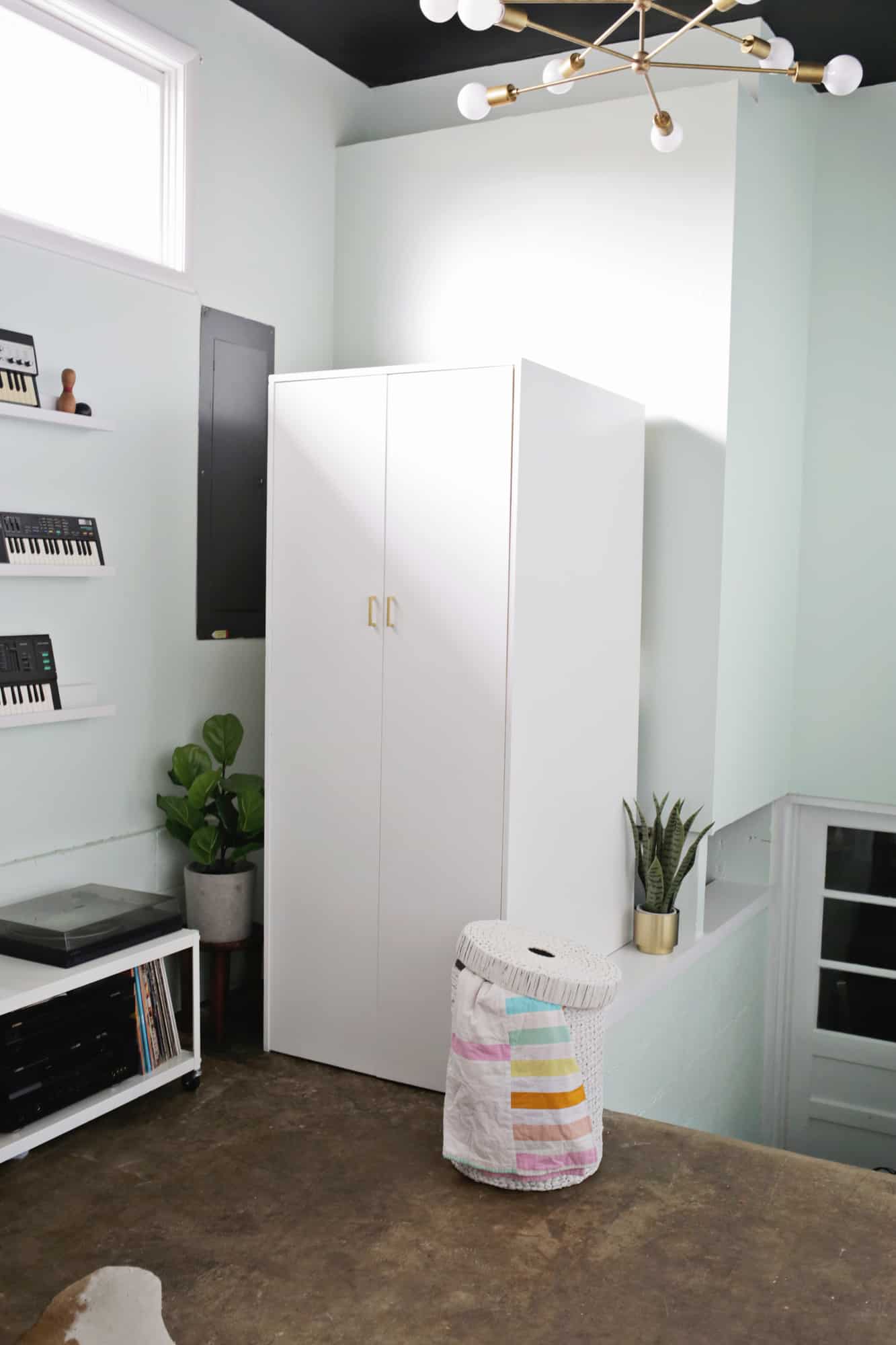 white cabinet with doors closed in a music room