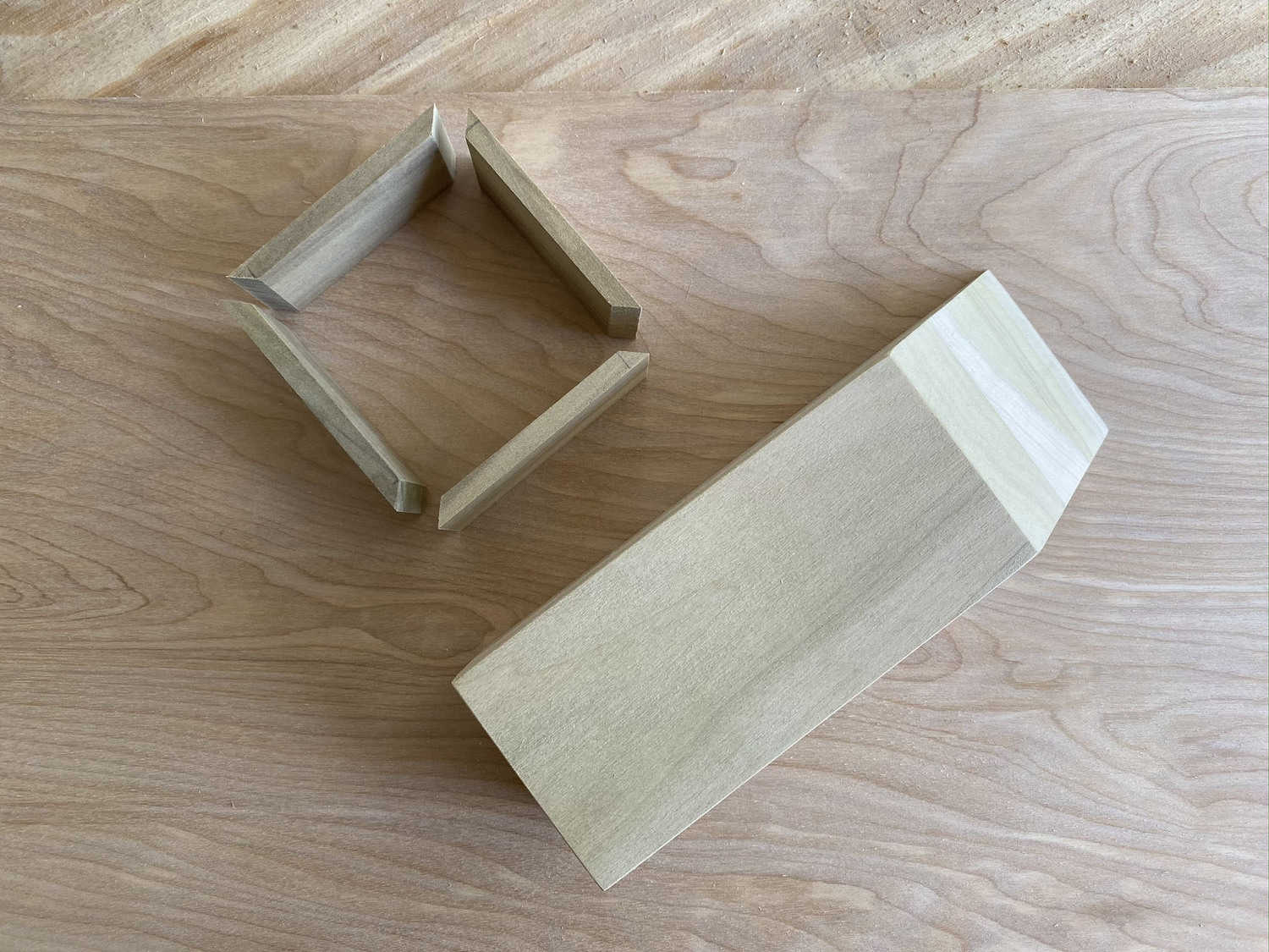 4 small pieces of wood in a square shape