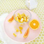orange creamsicle gummies on plate