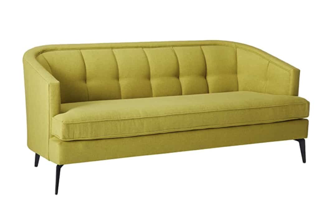 green sofa with curved back