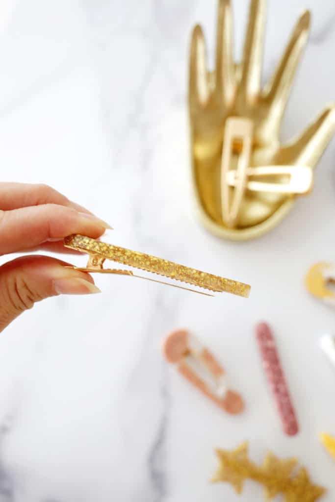 side view of gold glitter hair clip