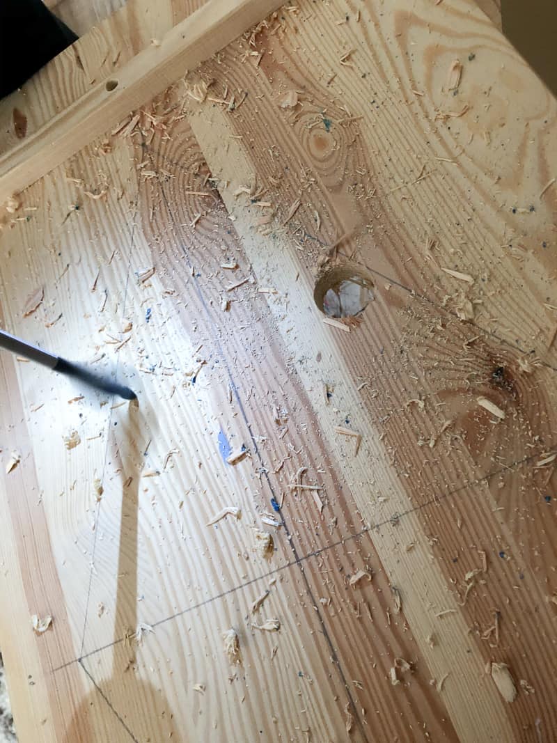 Drilling a hole in the cabinet door