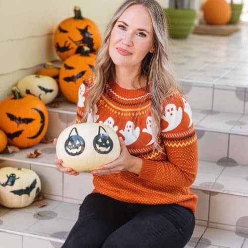 woman holding white pumpkin