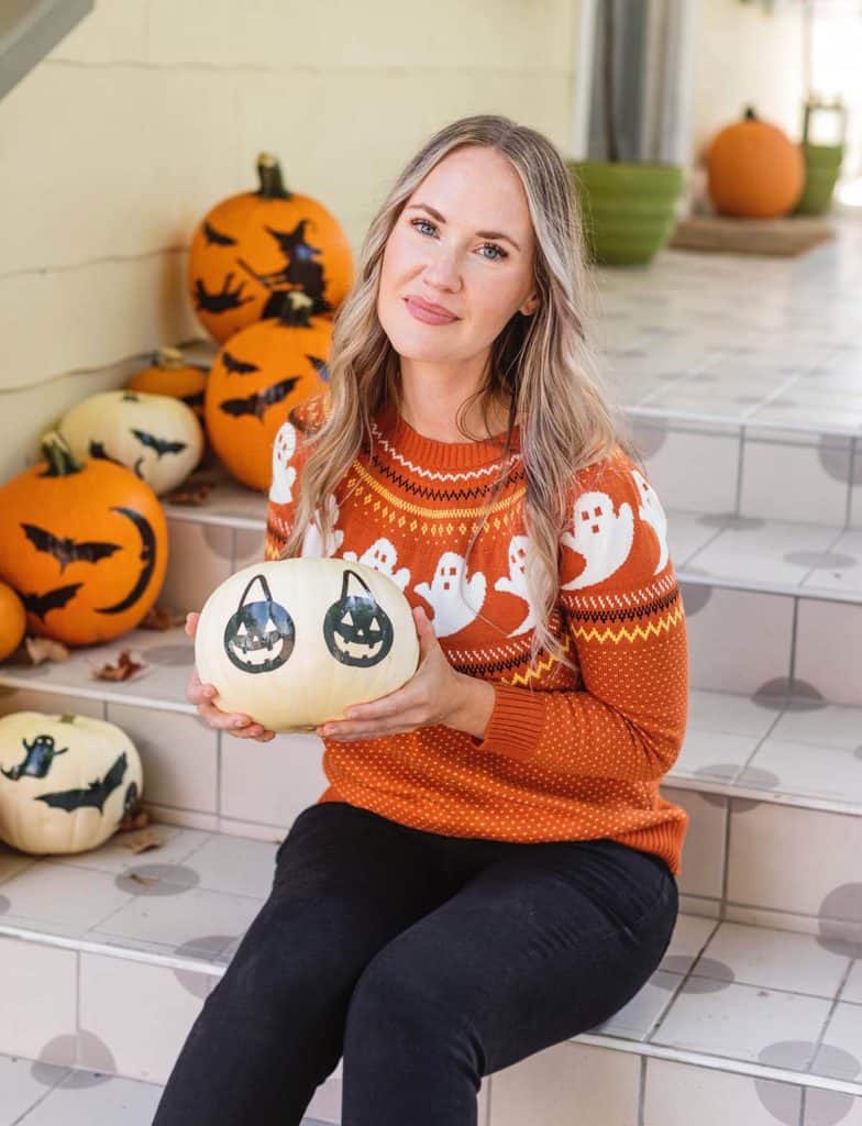 woman holding white pumpkin