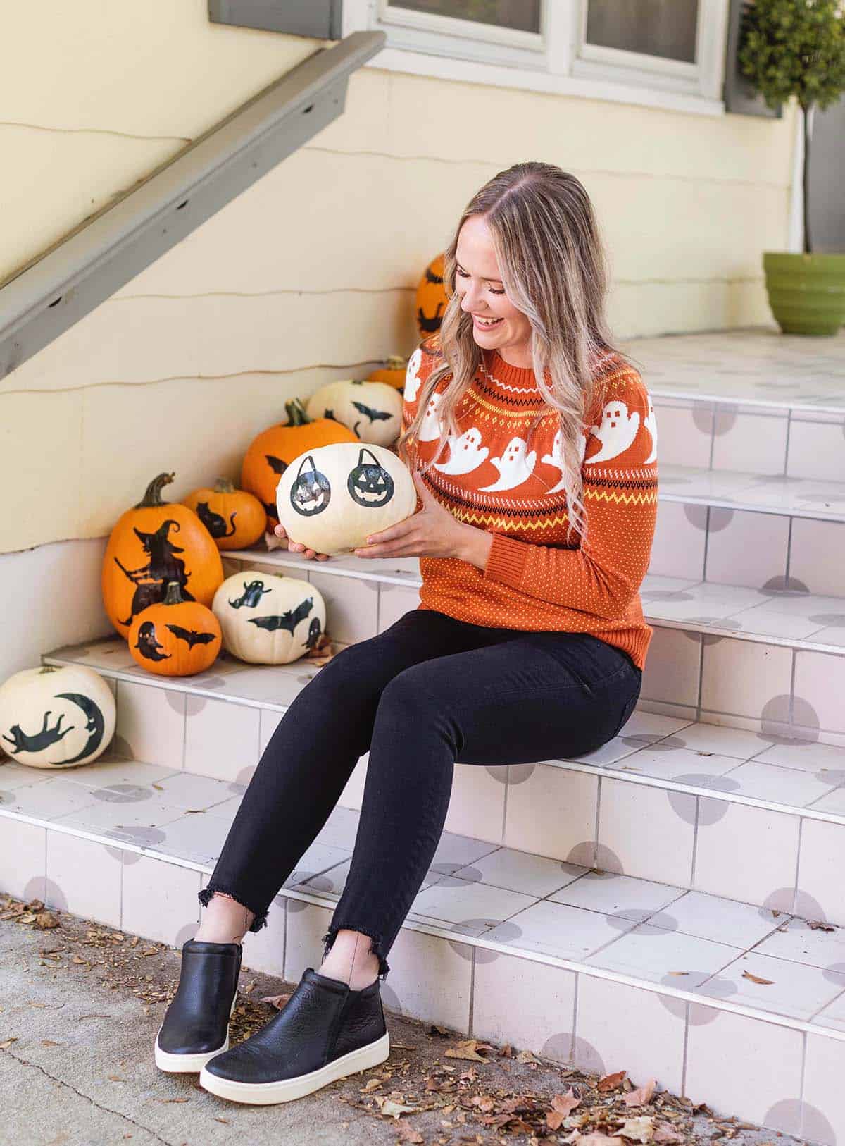 Emma holding a pumpkin