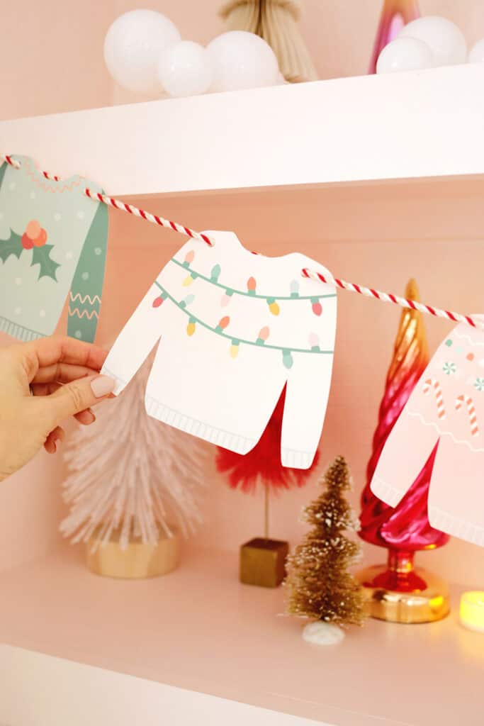 white paper christmas sweater on garland