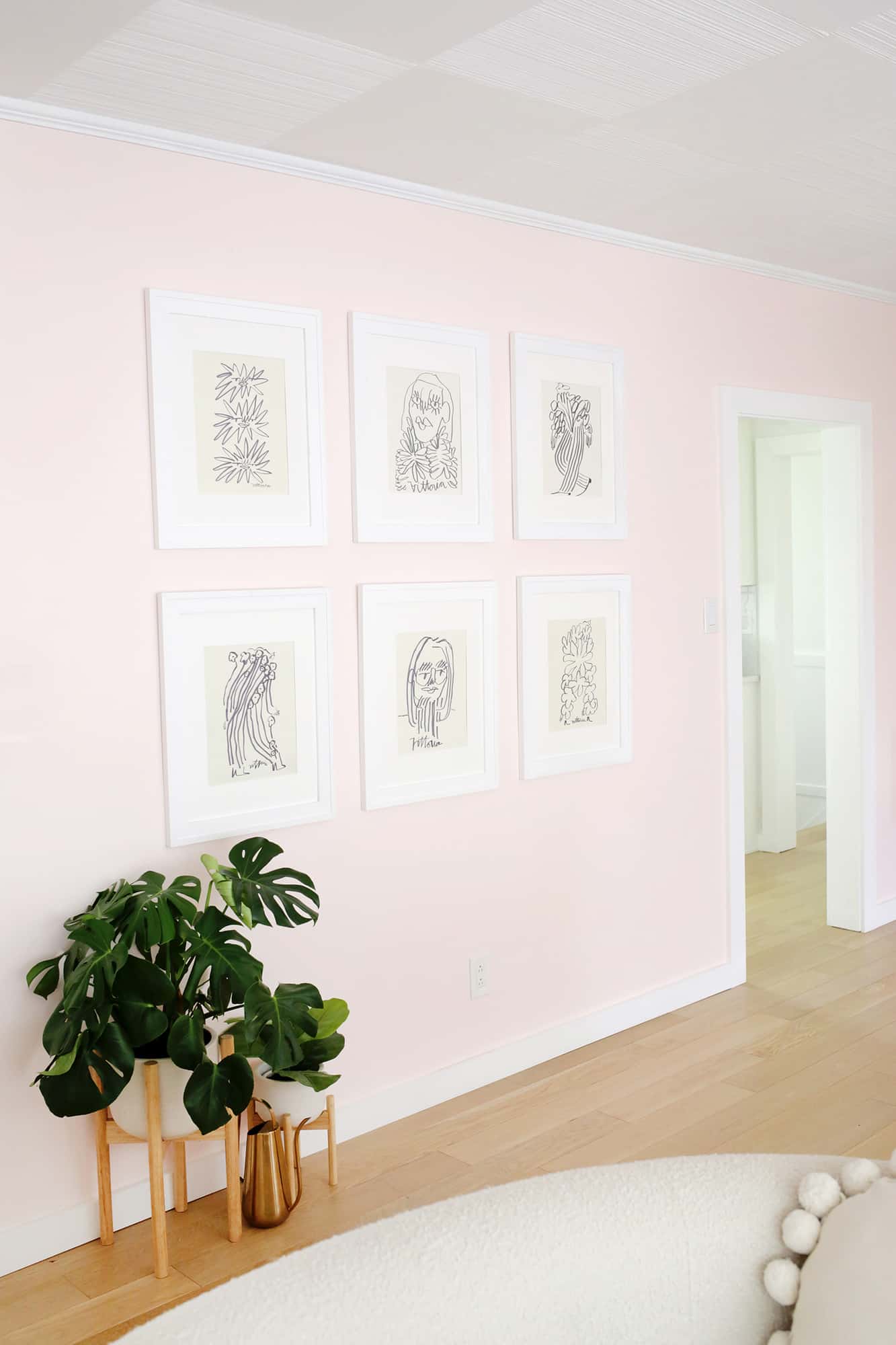 gallery wall with 6 hanging drawings