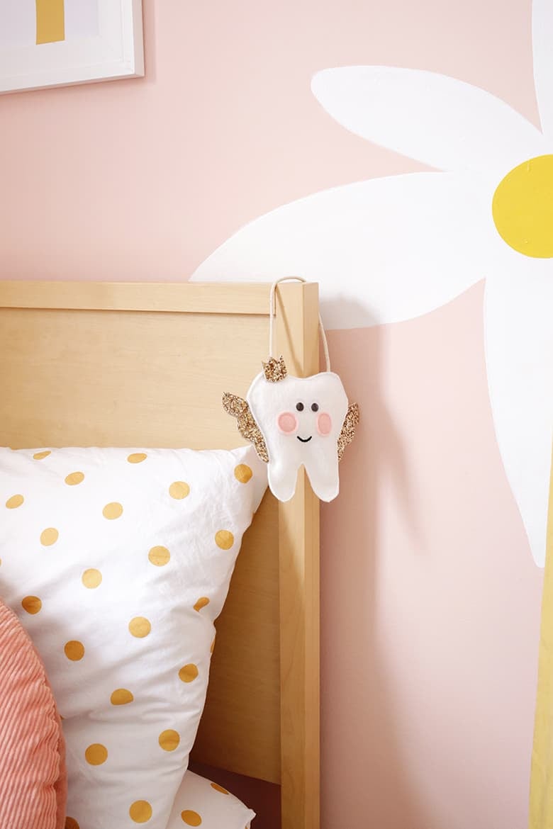 tooth fairy pillow hanging on bed post