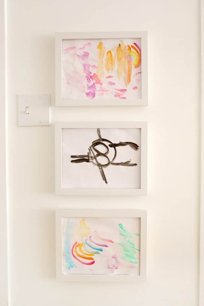 3 frames of kid's art frame display on wall