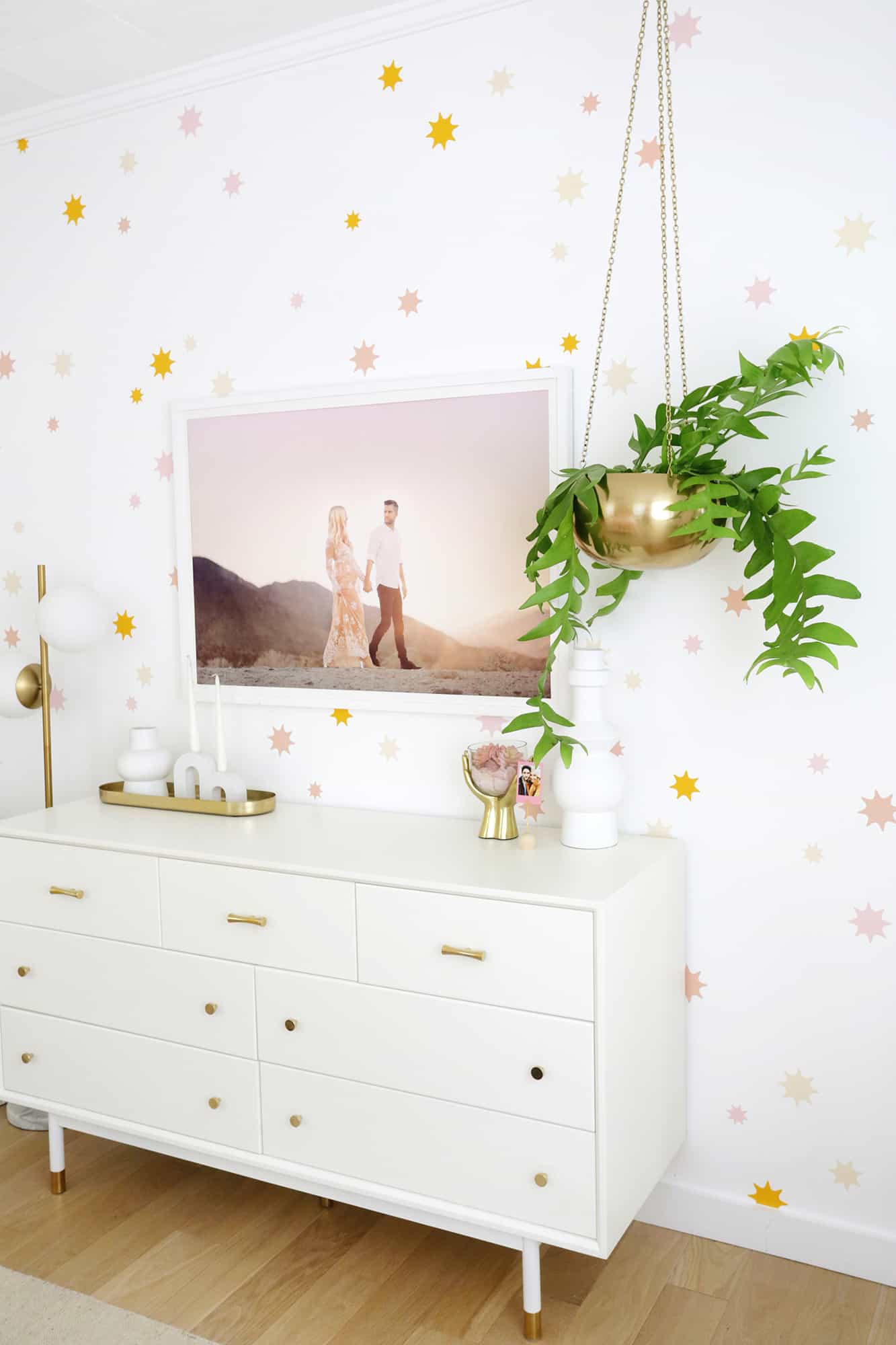 star wallpaper with wardrobe and hanging plant