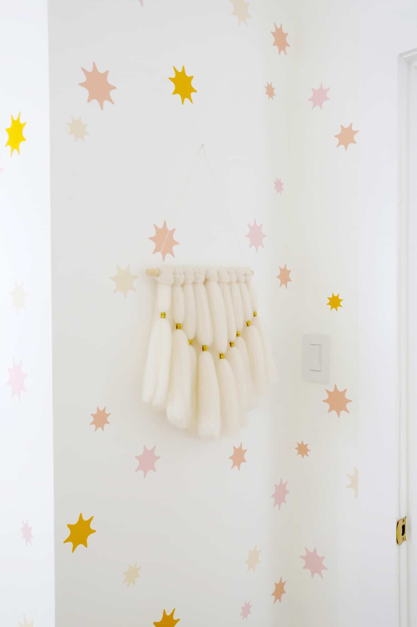 star wallpaper with a woven wall hanging