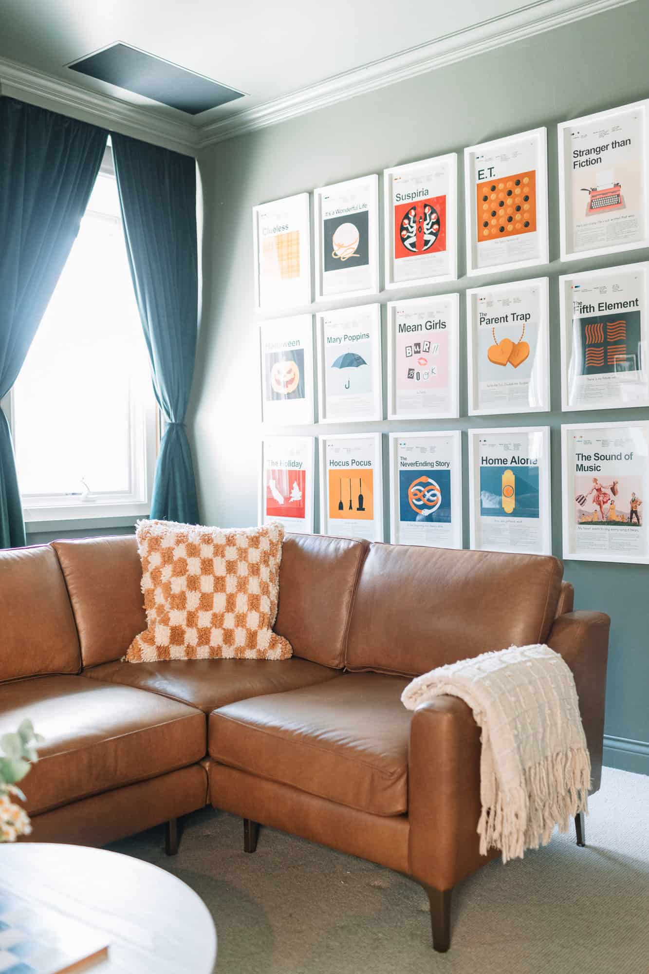 leather sectional and movie room wall art