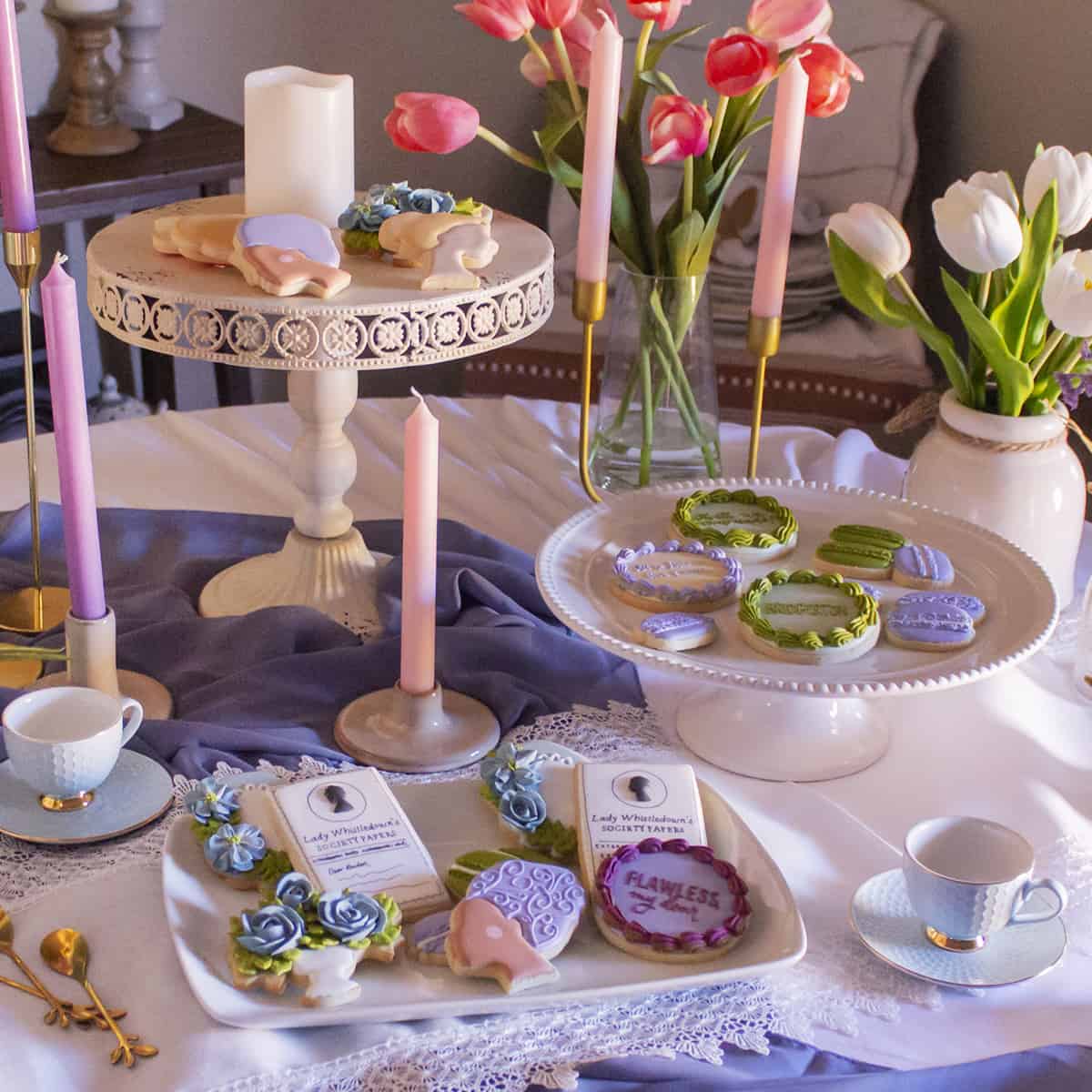 Bridgerton-inspired royal icing cookies displayed on table