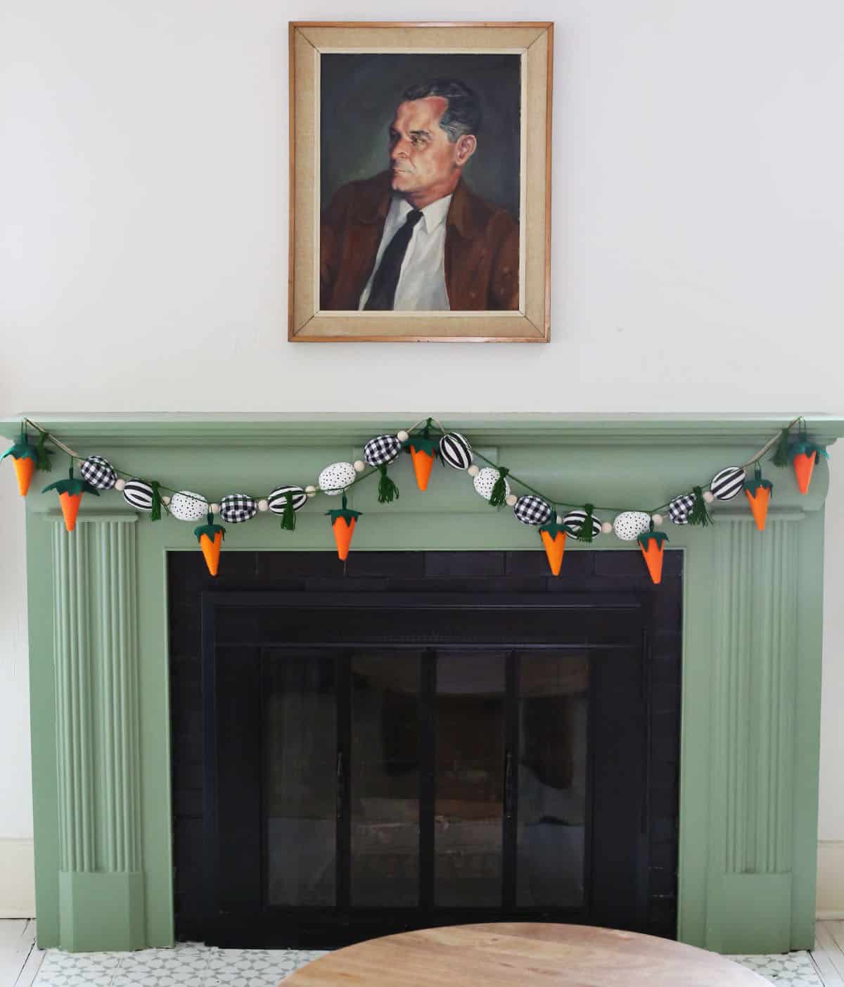 Carrot garland hanging on the green fireplace