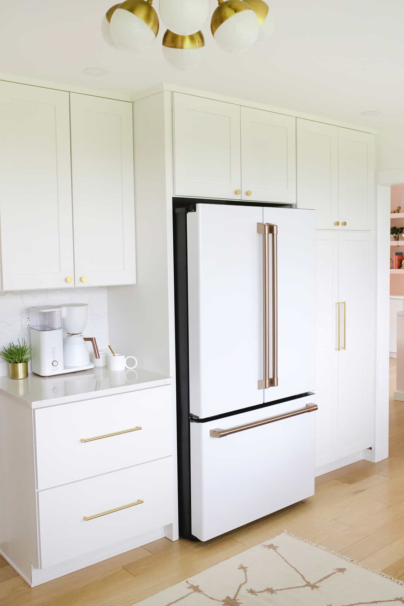 view of refrigerator with coffee maker on counter