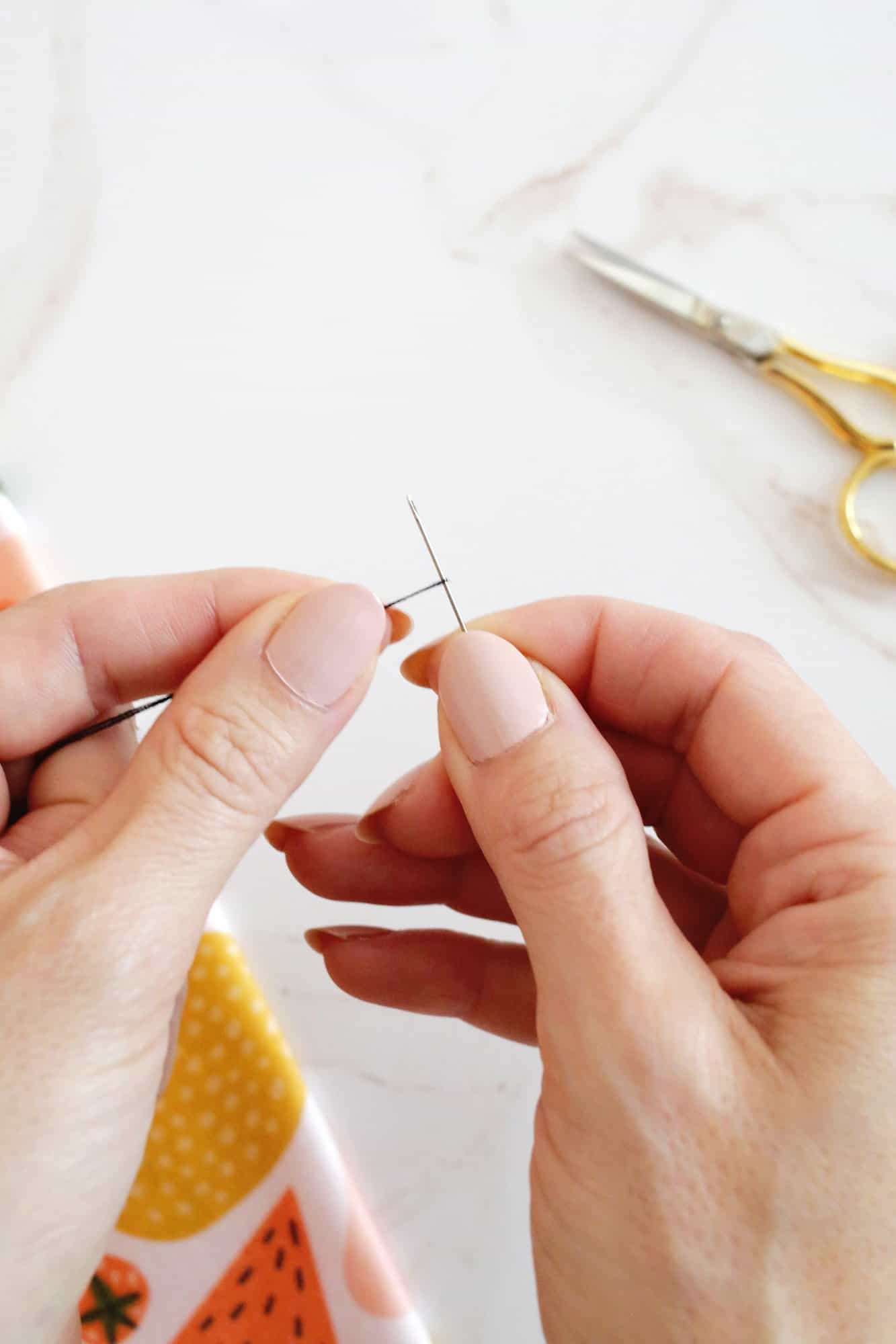 thread looped tight around a needle
