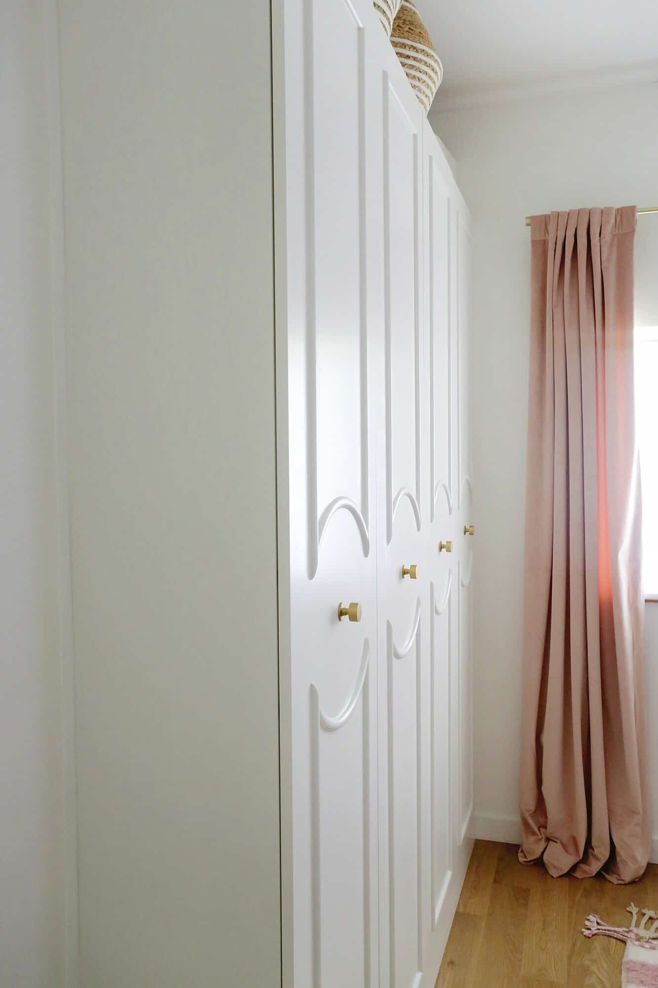 IKEA Pax wardrobes with arched trim added