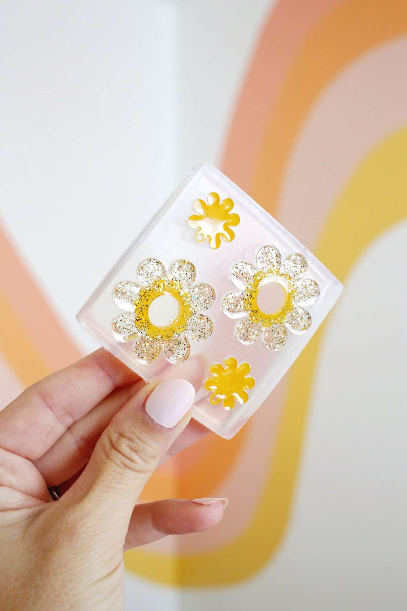 daisy earring mold with yellow and gold glitter epoxy