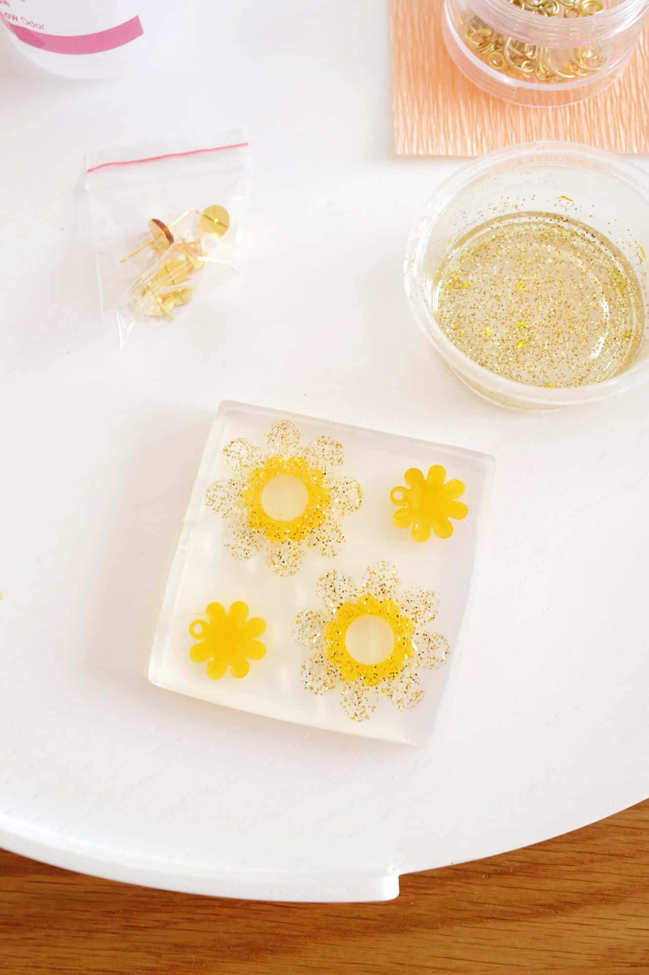 daisy mold filled with glitter epoxy