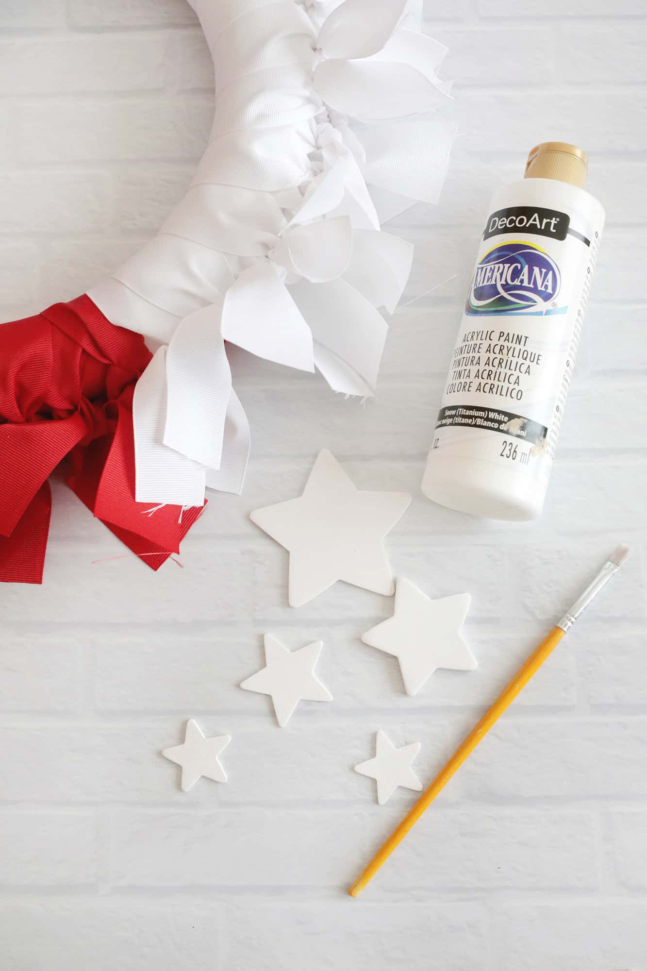 painting stars white for ribbon wreath