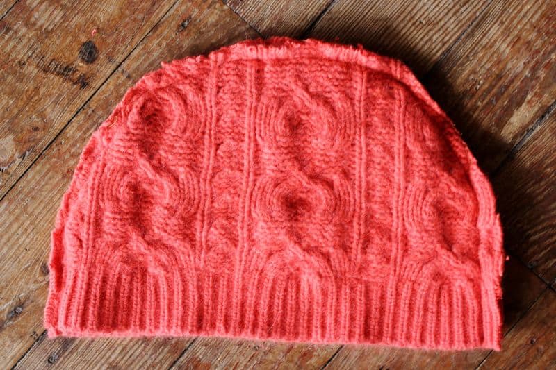 red knit hat turned inside out. 