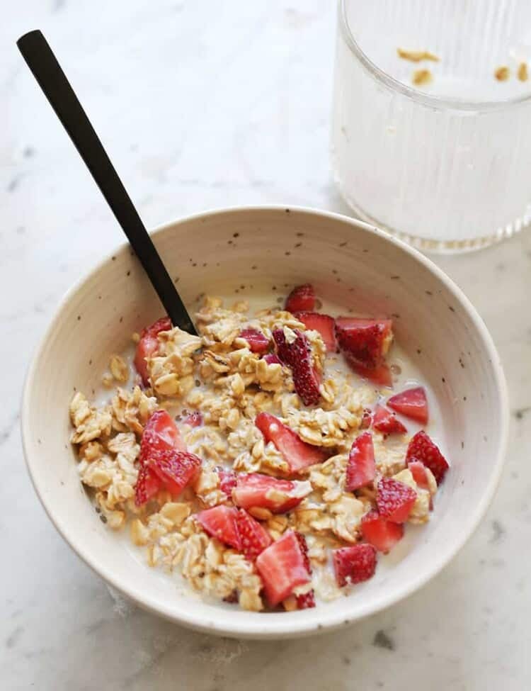 overnight oatmeal in a bowl with chopped strawberries