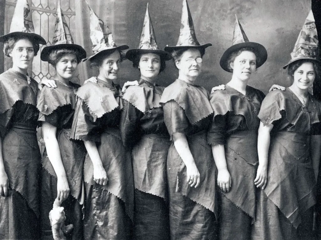 vintage print of women dressed as witches