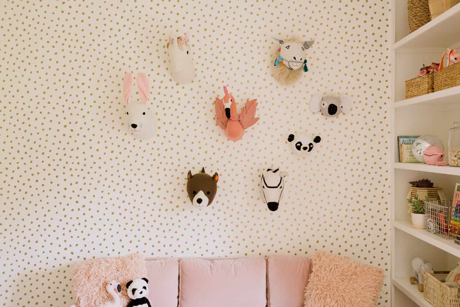 faux stuffed animal heads on wall