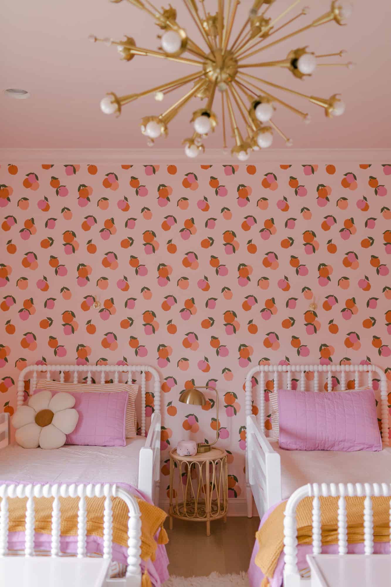 peach wallpaper with two beds in kids room