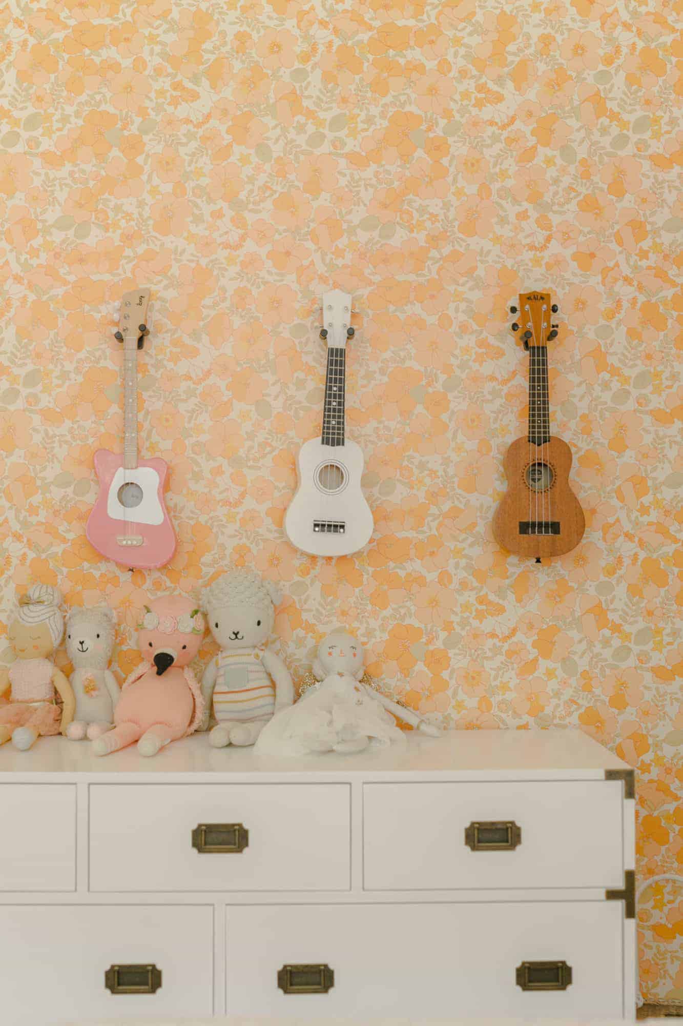 mini guitars on display in kid's room