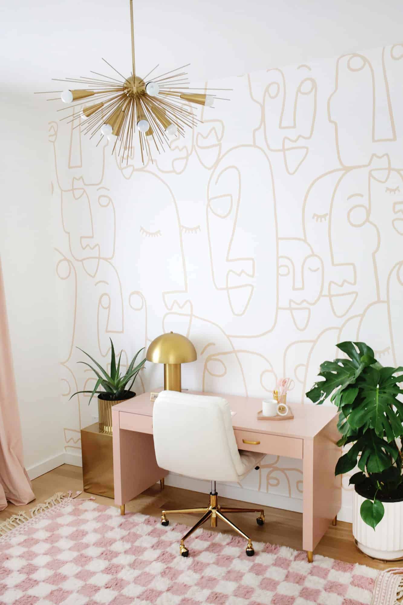 Office with wallpaper and pink desk