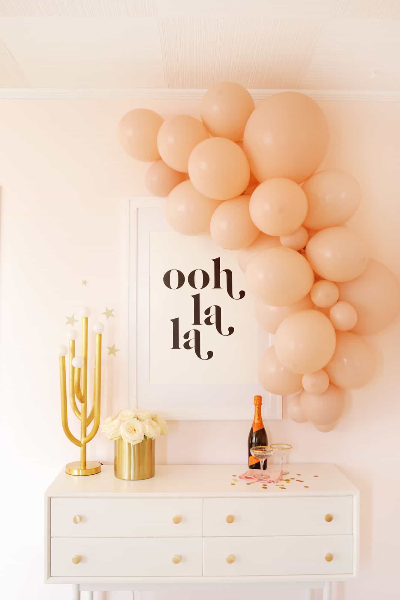 pink balloon garland over table