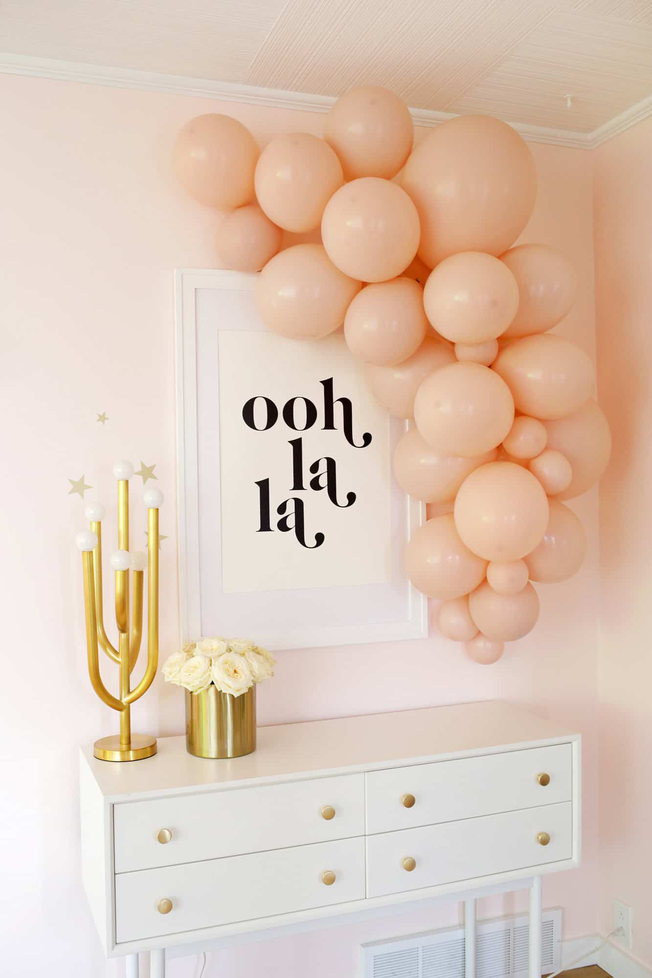 pink balloons to garland over table