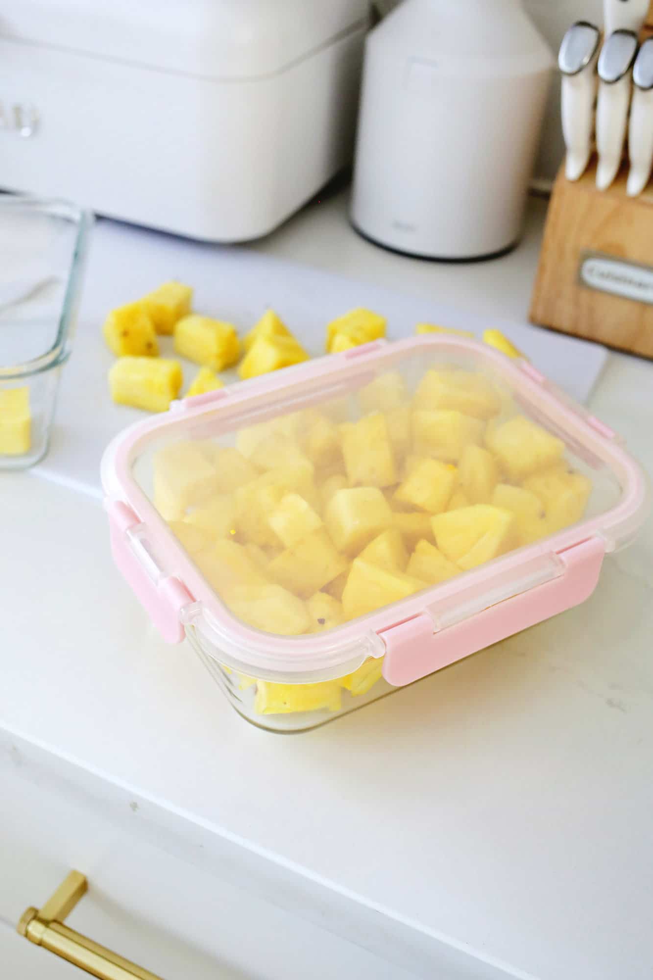 container of cut pineapple