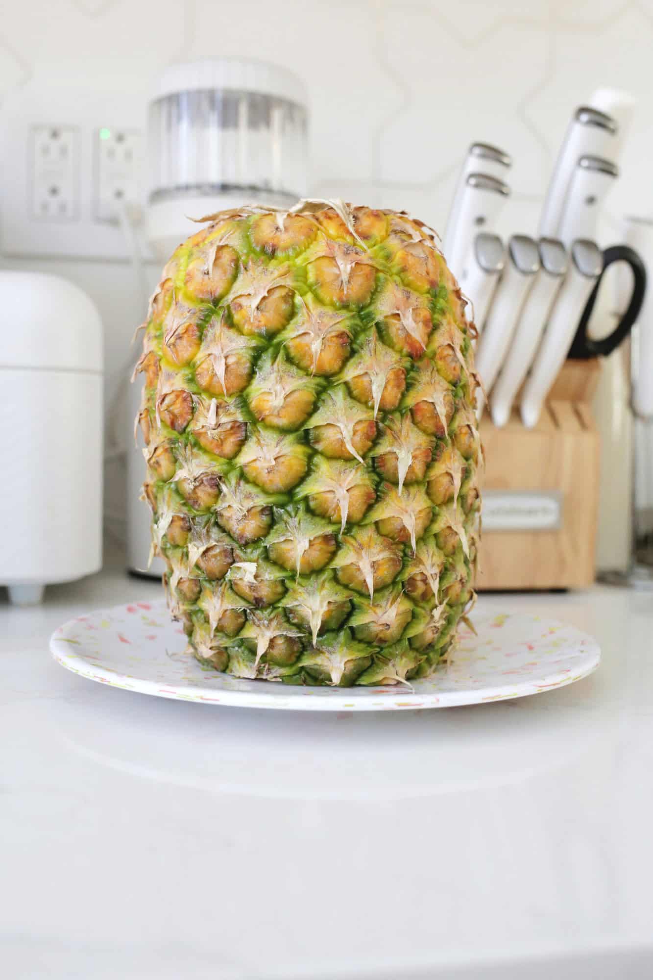 cut pineapple upside down on plate