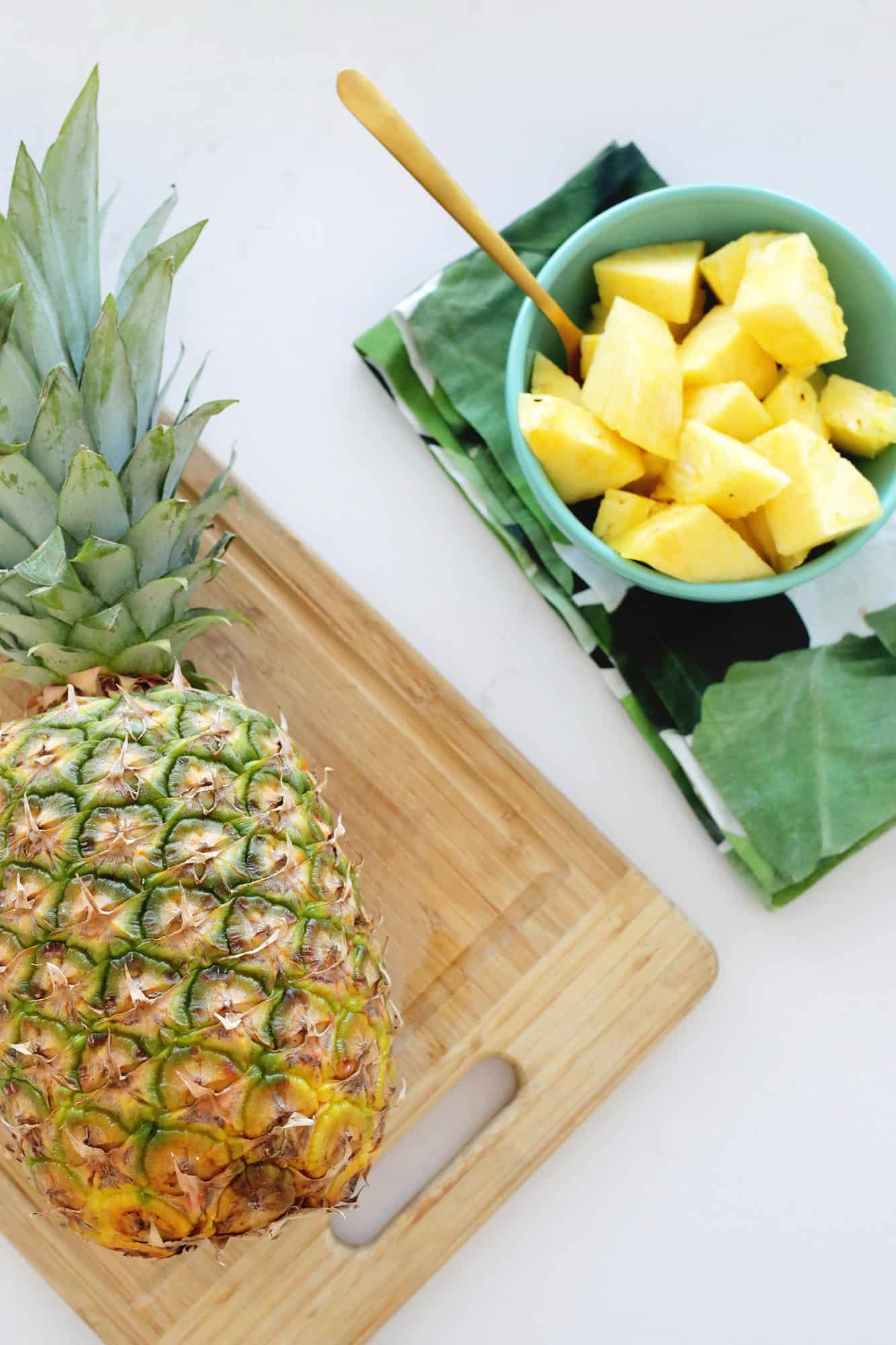 fresh and cut pineapple on the counter