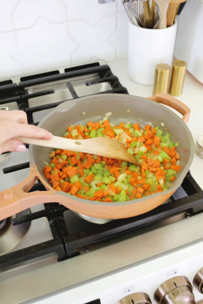cooking carrots and celery for chicken pot pie