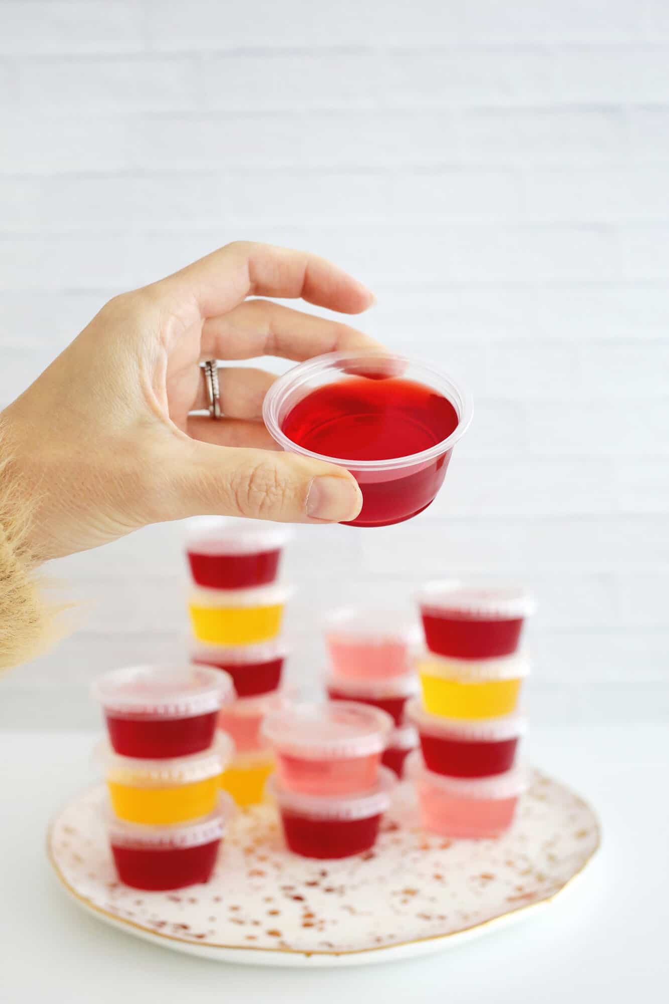 vodka jello shots stacked together in small cups