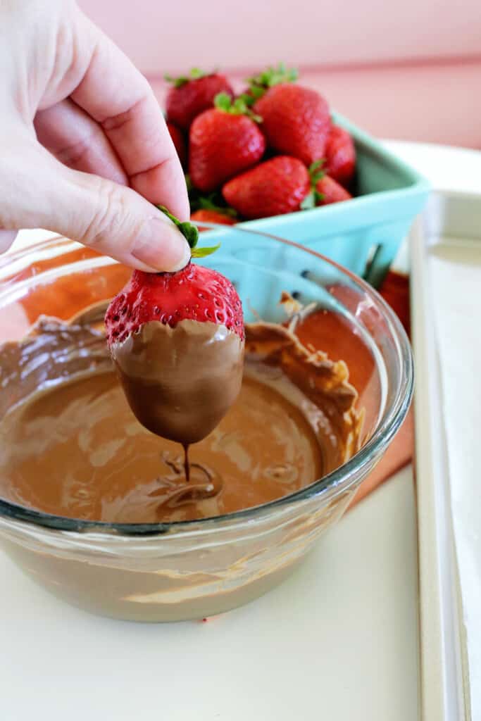 Dipping chocolate covered strawberry