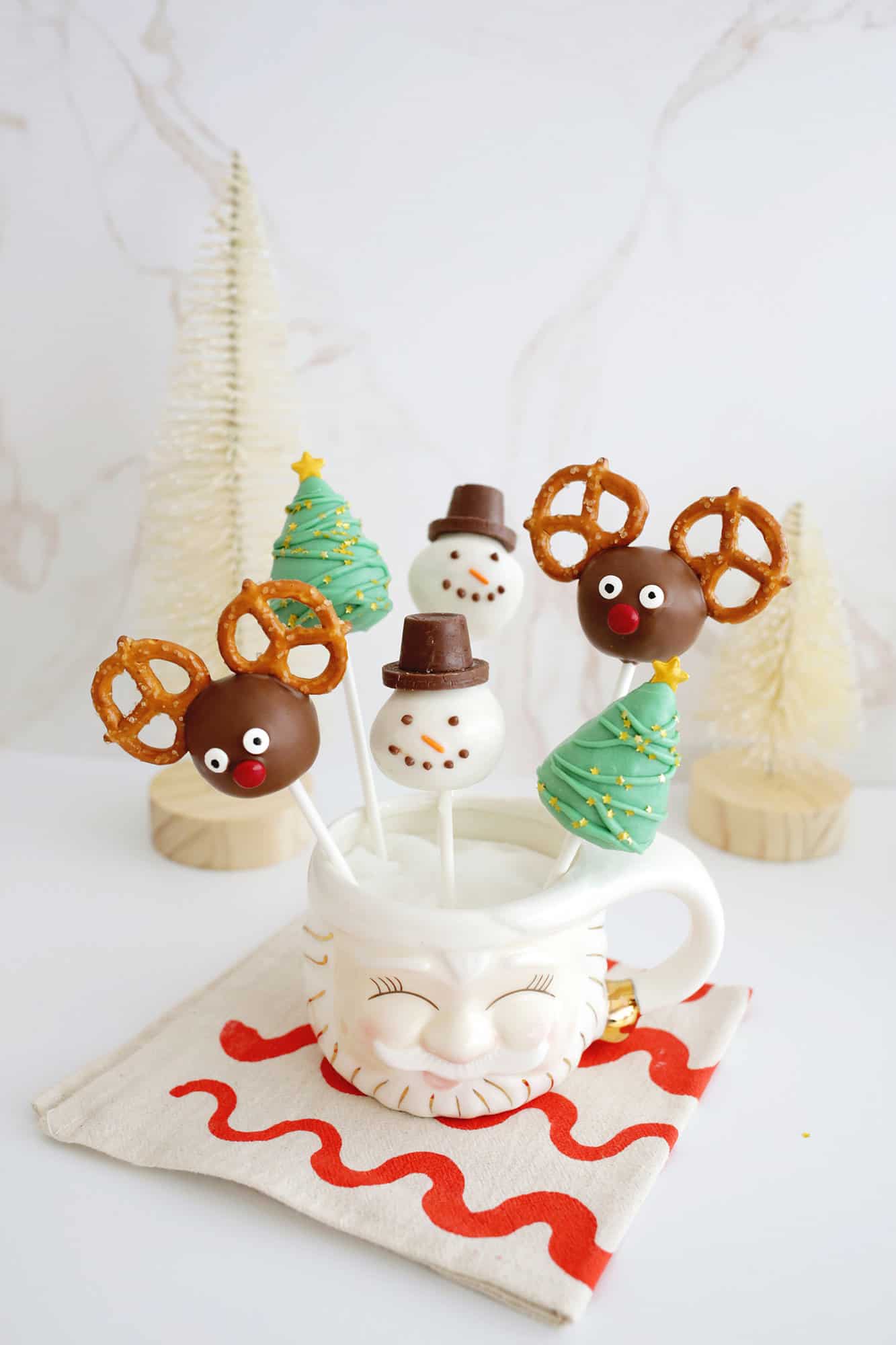 Christmas cake pops with reindeer, snowman, and Christmas tree