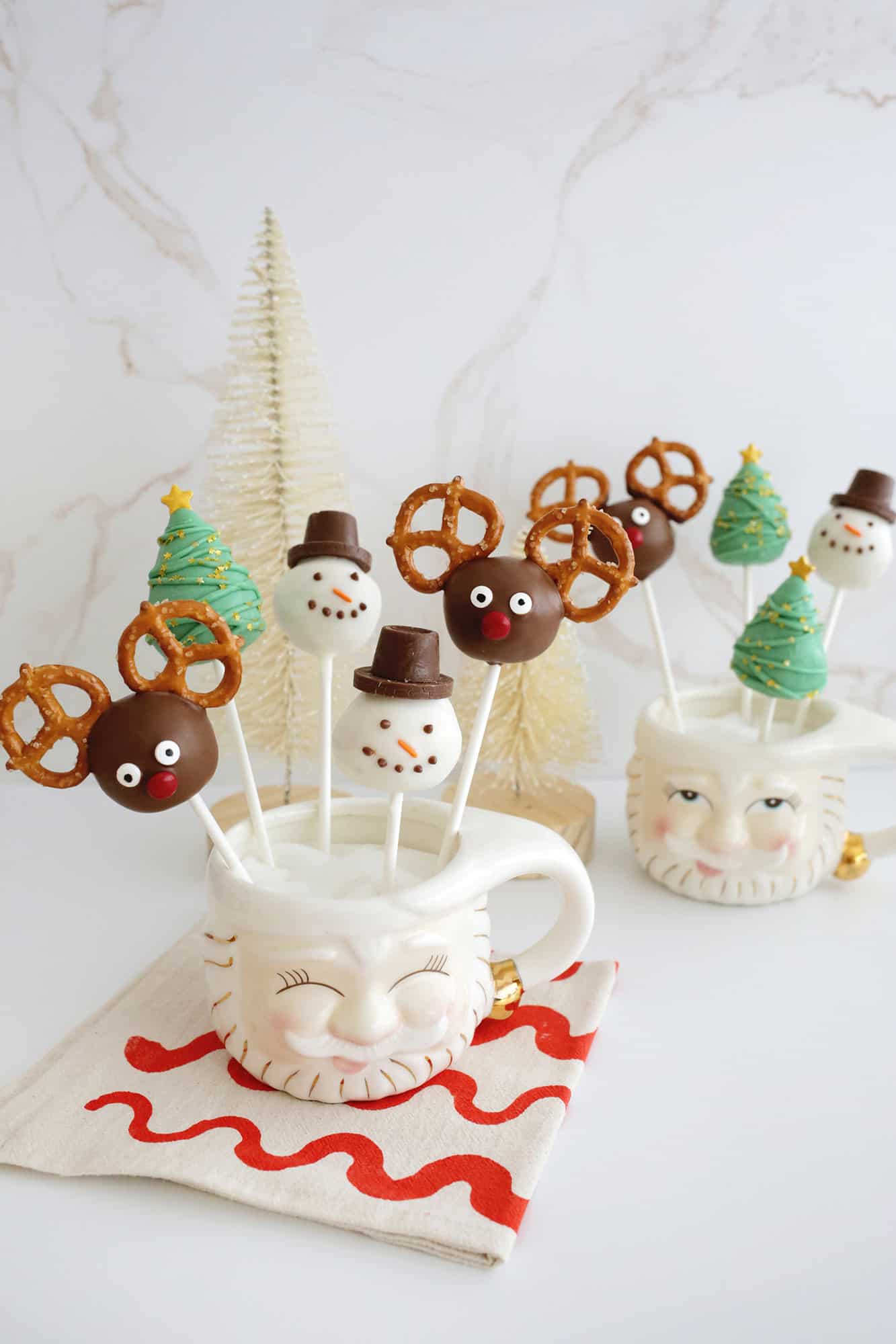 Christmas cake pops with reindeer, snowman, and Christmas tree