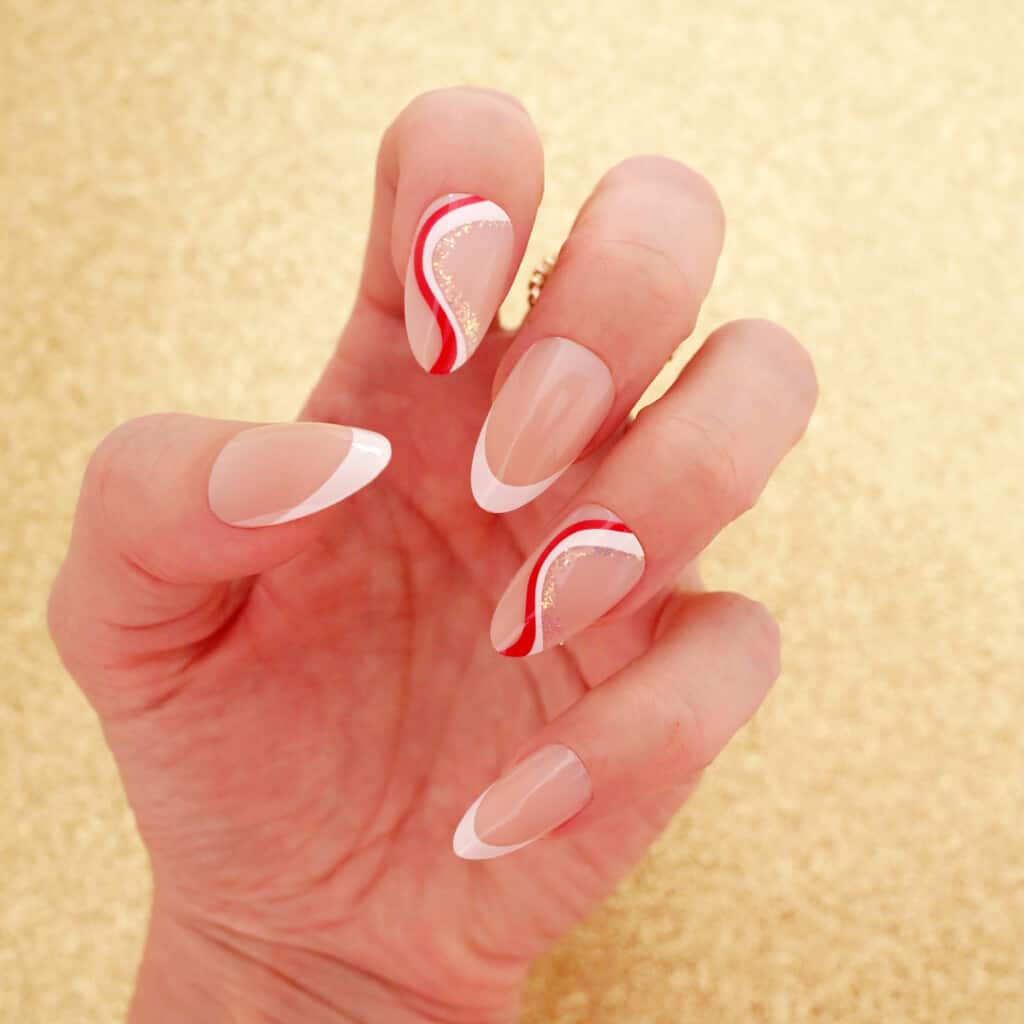 red and white waves christmas nail design