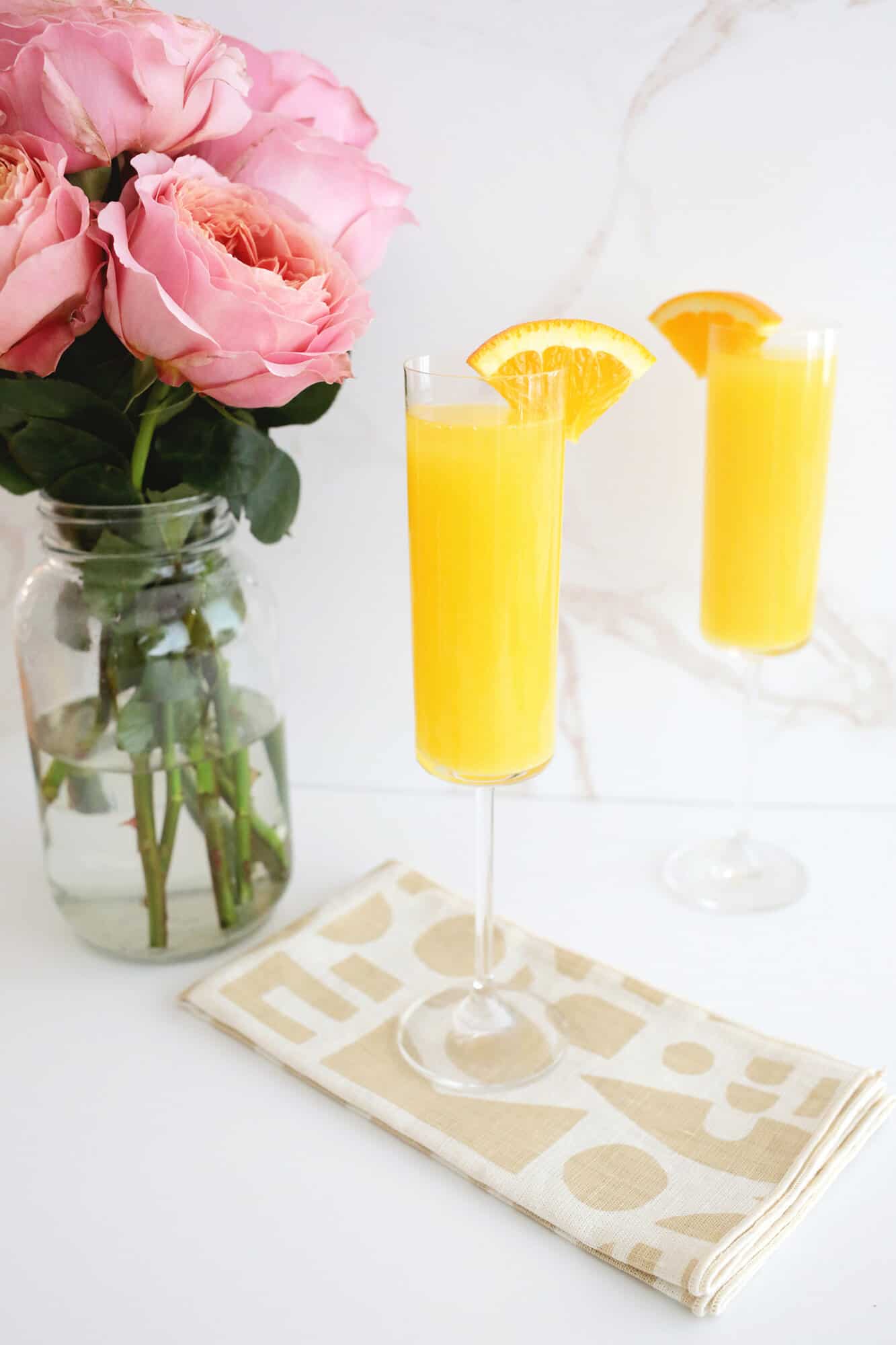 mimosa with orange wedge
