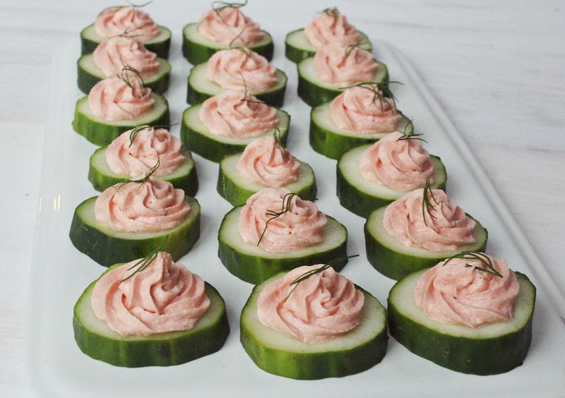 salmon mousse on top of slices of cumcumber 